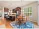 Open concept with kitchen island and dining area with big windows and natural lighting at 13645 Osage Ct, Broomfield, CO 80023