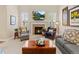 Living room features a fireplace, hardwood floors, and comfortable furnishings at 13645 Osage Ct, Broomfield, CO 80023