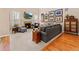 Bright living room features a cozy fireplace, comfortable seating and natural light at 13645 Osage Ct, Broomfield, CO 80023