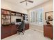 Home office with built-in bookcases, a large window, and a comfortable workspace at 13645 Osage Ct, Broomfield, CO 80023