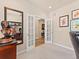 Bright office space featuring French doors and neutral tones, perfect for a home workspace at 13645 Osage Ct, Broomfield, CO 80023