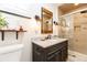 Stylish bathroom with a granite vanity, modern fixtures, and a tiled walk-in shower at 3098 S Vine St, Denver, CO 80210