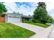 Charming ranch home with an attached two-car garage and mature landscaping in a quiet, residential neighborhood at 3098 S Vine St, Denver, CO 80210