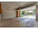 Spacious two-car garage with an open door and painted brick walls at 3098 S Vine St, Denver, CO 80210