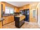 Functional kitchen with granite countertops, a kitchen island, and stainless steel appliances at 3098 S Vine St, Denver, CO 80210