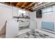 Laundry room featuring washer, dryer, utility sink, overhead light, and geometric rug at 3098 S Vine St, Denver, CO 80210
