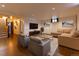 Spacious living room with wood floors, recessed lights, shiplap accent wall, and comfortable seating at 3098 S Vine St, Denver, CO 80210