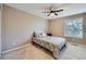 Bedroom with a queen-sized bed and a neutral color scheme at 2865 S Yampa Way, Aurora, CO 80013