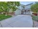 Charming two-story home with a covered front porch and an extended driveway at 2865 S Yampa Way, Aurora, CO 80013