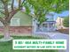 Inviting two-story home with a covered porch, mature trees, and well-maintained front yard at 2865 S Yampa Way, Aurora, CO 80013