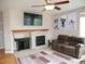 Cozy living room featuring a fireplace, mantle and mounted TV at 2865 S Yampa Way, Aurora, CO 80013