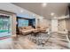 Inviting living room with recessed lighting, plush sofas, and sliding door access to the backyard at 2865 S Yampa Way, Aurora, CO 80013