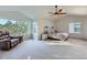 Spacious main bedroom featuring vaulted ceilings, large windows, and a cozy seating area at 2865 S Yampa Way, Aurora, CO 80013