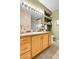 Well-lit bathroom features vanity with storage, decorative shelves and a glass-enclosed shower at 457 Black Feather Loop # 703, Castle Rock, CO 80104
