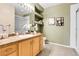 A bathroom with a vanity, decorative shelves and lighting, plus a shower behind glass at 457 Black Feather Loop # 703, Castle Rock, CO 80104