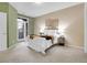 A bright bedroom with a balcony, creating a cozy and inviting retreat within the home at 457 Black Feather Loop # 703, Castle Rock, CO 80104