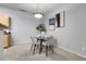 Modern dining area featuring elegant decor and a stylish glass-top table at 457 Black Feather Loop # 703, Castle Rock, CO 80104