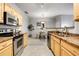Open-concept kitchen and dining area, featuring modern appliances and a stylish dining set at 457 Black Feather Loop # 703, Castle Rock, CO 80104