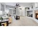 Neutral living room with fireplace, views to the entry, and bright, natural light at 457 Black Feather Loop # 703, Castle Rock, CO 80104