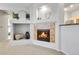 Cozy living room featuring a fireplace, built-in shelving, and neutral decor at 457 Black Feather Loop # 703, Castle Rock, CO 80104