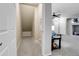 A functional storage nook leading to a living area, blending practicality with home design at 457 Black Feather Loop # 703, Castle Rock, CO 80104