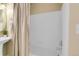 A clean bath features a showerhead and faucet, with a shower curtain at 457 Black Feather Loop # 703, Castle Rock, CO 80104