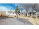 Large backyard with mature trees, providing ample space for outdoor activities and relaxation at 4154 Depew St, Denver, CO 80212