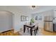 Cozy dining area featuring natural light, hardwood floors, and space for Gathering meals at 4154 Depew St, Denver, CO 80212