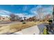 Landscaped front yard with green grass and a paved walkway leading to the house at 4154 Depew St, Denver, CO 80212