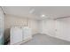 Well-lit laundry room with modern appliances, clean lines, and ample space for chores at 4154 Depew St, Denver, CO 80212