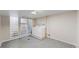 Functional laundry room with tiled floors, a utility sink, and a glass block window at 4154 Depew St, Denver, CO 80212