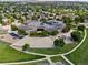 Aerial view of school with solar panels, playground, basketball courts and a walking path at 885 Sage Sparrow Cir, Highlands Ranch, CO 80129