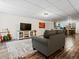 Relaxing basement living area with cozy seating, flooring, and open layout at 885 Sage Sparrow Cir, Highlands Ranch, CO 80129