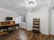 Finished basement with wood-look floors and a work space at 885 Sage Sparrow Cir, Highlands Ranch, CO 80129