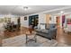Open basement layout with sitting and dining area, including wood-look vinyl flooring at 885 Sage Sparrow Cir, Highlands Ranch, CO 80129