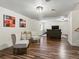 Finished basement with vinyl flooring, a seating area, and neutral-colored walls at 885 Sage Sparrow Cir, Highlands Ranch, CO 80129