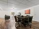 Basement poker table with seating, plus a view of living area and TV at 885 Sage Sparrow Cir, Highlands Ranch, CO 80129