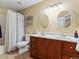 Bright bathroom featuring a double vanity with marble countertops and tiled floors at 885 Sage Sparrow Cir, Highlands Ranch, CO 80129