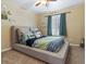 Modern bedroom with window, bed, and decorations creating a cheerful space at 885 Sage Sparrow Cir, Highlands Ranch, CO 80129