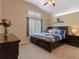 Cozy bedroom with natural light, vaulted ceiling, and a comfortable bed set at 885 Sage Sparrow Cir, Highlands Ranch, CO 80129