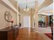 Grand foyer featuring hardwood floors, high ceilings, and elegant chandelier at 885 Sage Sparrow Cir, Highlands Ranch, CO 80129