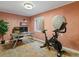 Bright home gym features modern exercise equipment and a stylish desk space at 885 Sage Sparrow Cir, Highlands Ranch, CO 80129