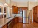 Beautiful kitchen featuring granite countertops, stainless steel appliances, and custom cabinets at 885 Sage Sparrow Cir, Highlands Ranch, CO 80129