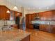 Beautiful kitchen featuring granite countertops, stainless steel appliances, and custom cabinets at 885 Sage Sparrow Cir, Highlands Ranch, CO 80129