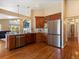 Bright and airy kitchen with stainless steel refrigerator and hardwood floors throughout at 885 Sage Sparrow Cir, Highlands Ranch, CO 80129