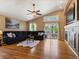 Spacious living room with hardwood floors, fireplace, and access to the backyard at 885 Sage Sparrow Cir, Highlands Ranch, CO 80129