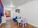 ' playroom with colorful decor, vinyl flooring, a table, and a convertible sofa at 885 Sage Sparrow Cir, Highlands Ranch, CO 80129