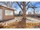 Backyard with flagstone patio and mature shade tree at 1151 S Nome St, Aurora, CO 80012