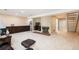 Spacious finished basement featuring a cozy fireplace and adjacent stairway to upper level at 7755 E Quincy Ave # T80, Denver, CO 80237