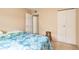 Comfortable bedroom with neutral walls, a bed, and closet at 7755 E Quincy Ave # T80, Denver, CO 80237